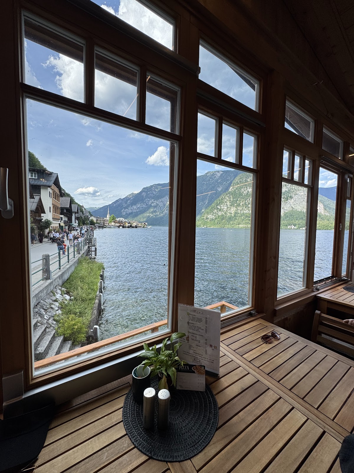 Timber-framed café interior overlooking the lake